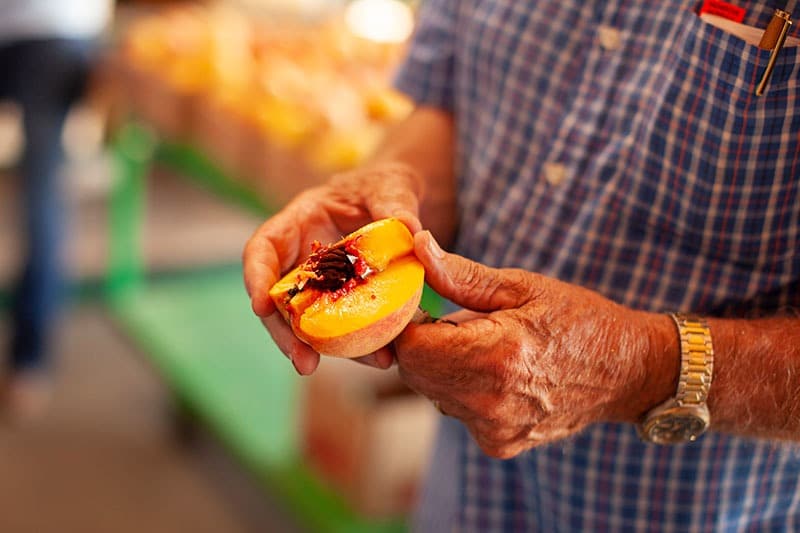 Image of a sliced peach with pit