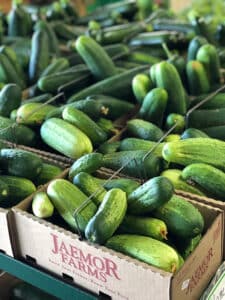 Baskets full of green cucumbers