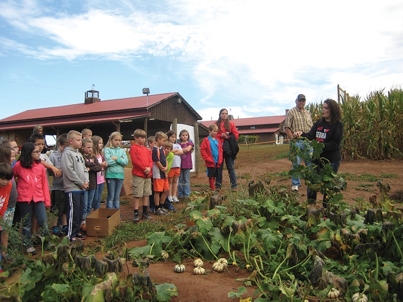 Image of children on field trip learning about pumpkins