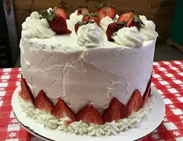 Strawberries and cream cheesecake cake