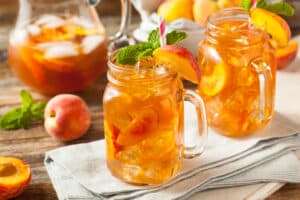 Two Glasses of Fresh Homemade Peach Sweet Tea with Mint